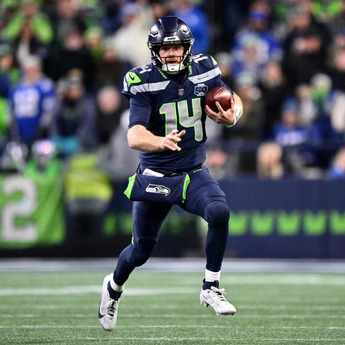 Sam Darnold of the Seattle Seahawks running with the ball during the fourth quarter of the 31-27 win over the Los Angeles Rams in the NFC Championship game at Lumen Field on Jan 25, 2026 in Seattle, Washington. 