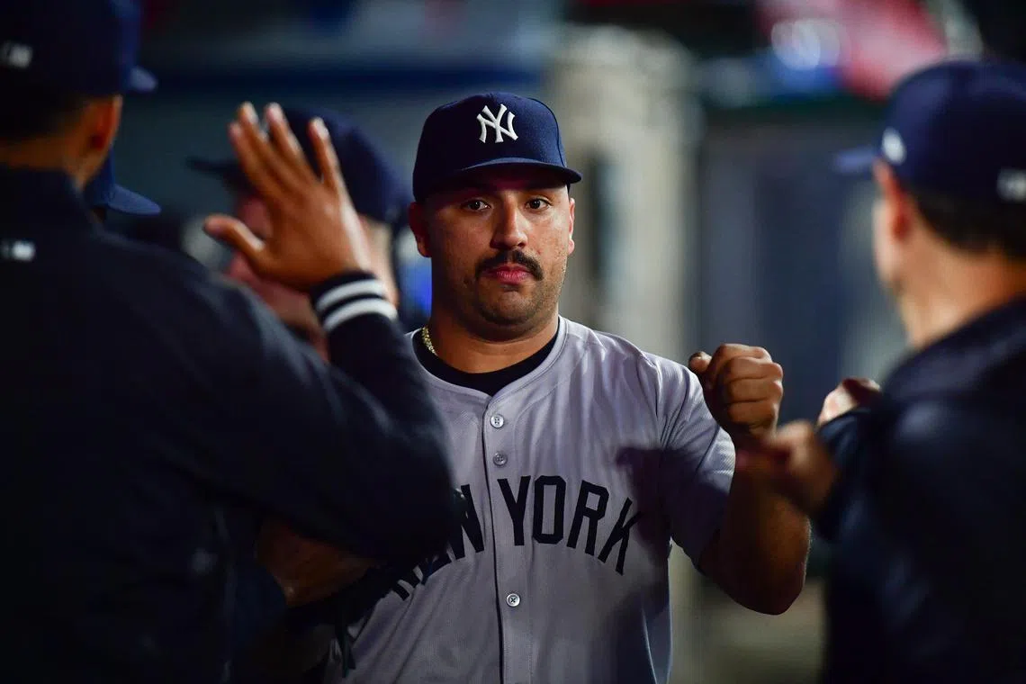 FILE PHOTO: May 28, 2024; Anaheim, California, USA; New York Yankees pitcher Nestor Cortes (65) is greeted after being relieved against the Los Angeles Angels during the sixth inning at Angel Stadium. Mandatory Credit: Gary A. Vasquez-USA TODAY Sports/File Photo