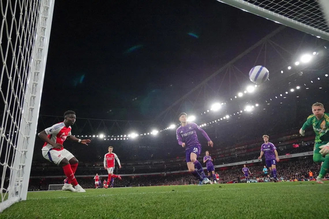 Arsenal's Bukayo Saka scores the winning goal against Fulham.