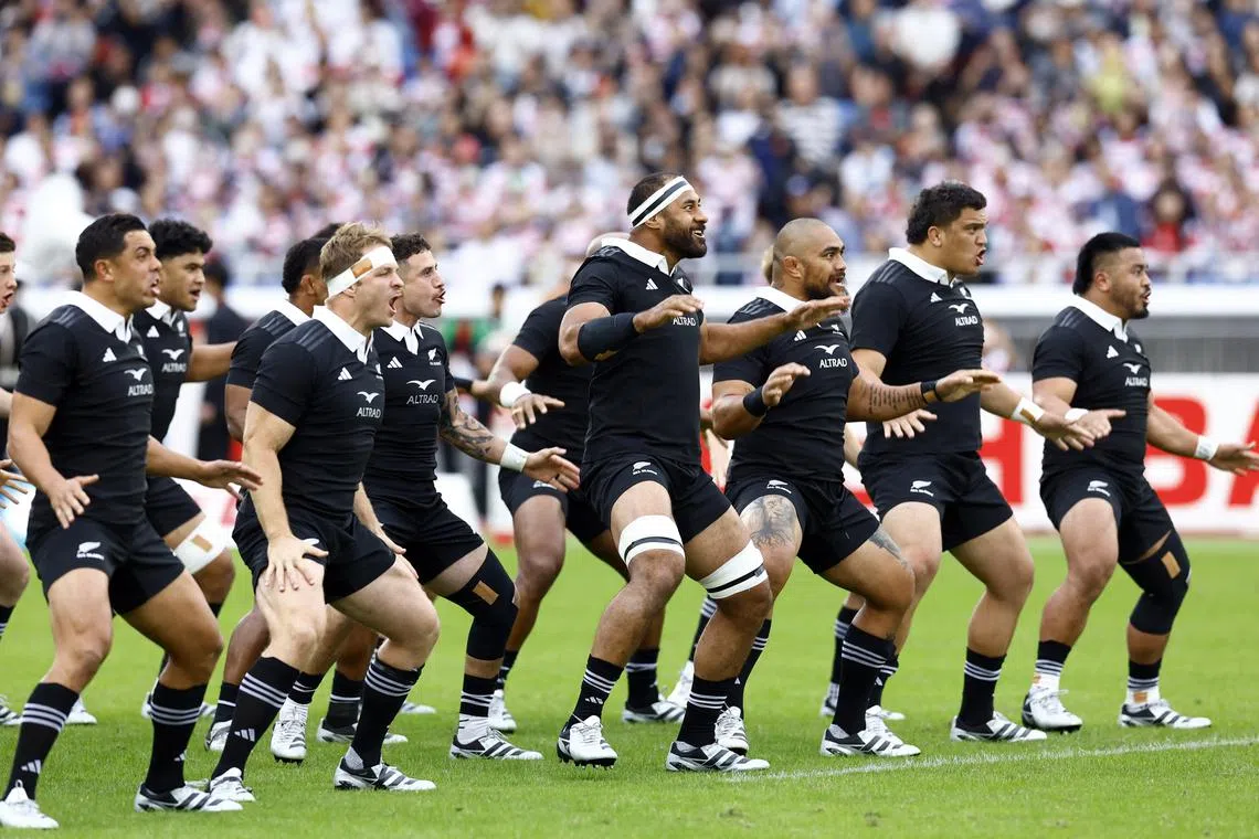 New Zealand players perform a haka before the match between Japan and New Zealand on Oct 26.