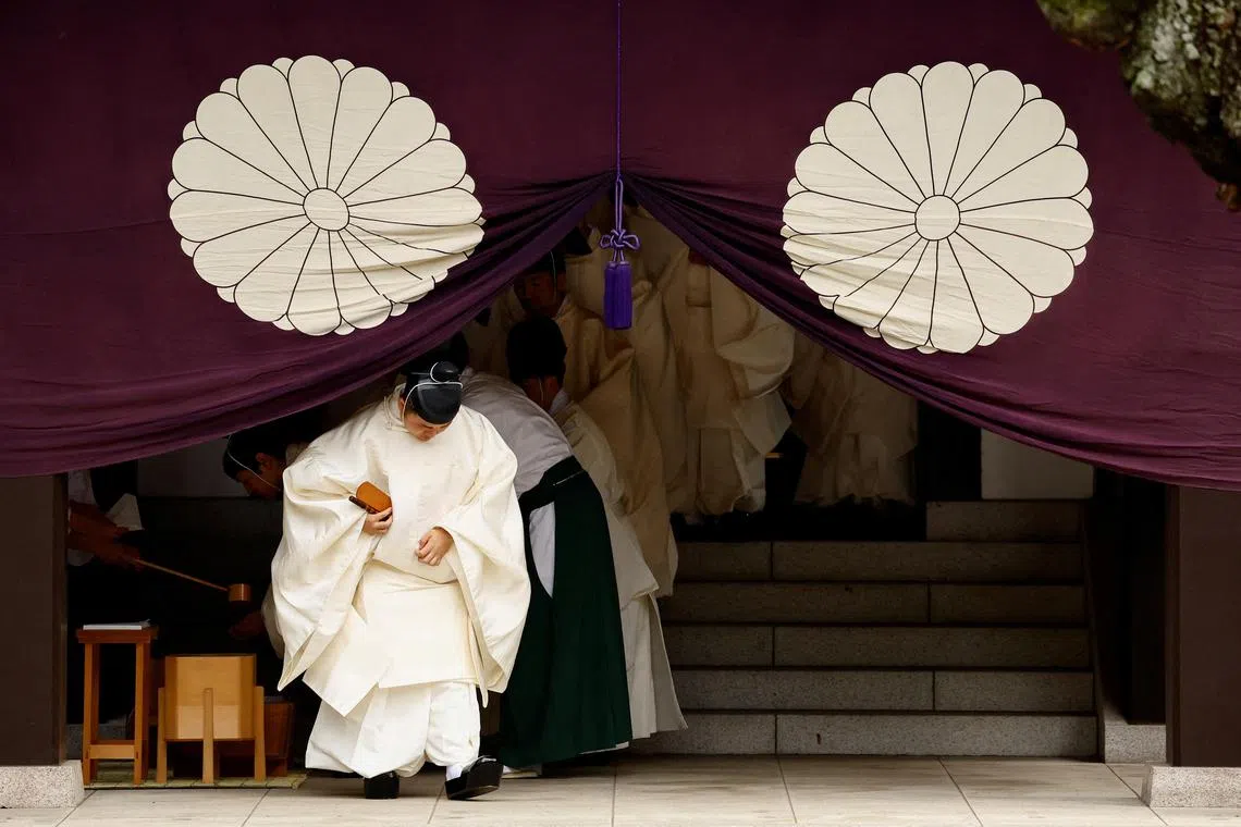Japanese Shinto priests attend a ritual during an autumn festival at Yasukuni Shrine in Tokyo, Japan, October 17, 2024. REUTERS/Issei Kato     TPX IMAGES OF THE DAY     