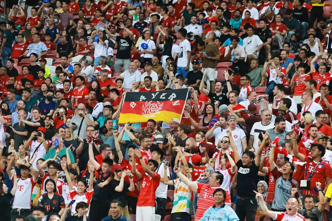 Bayern Munich fans cheer at the Singapore Festival of Football friendly match between Liverpool and Bayern Munich on Aug 2, 2023.