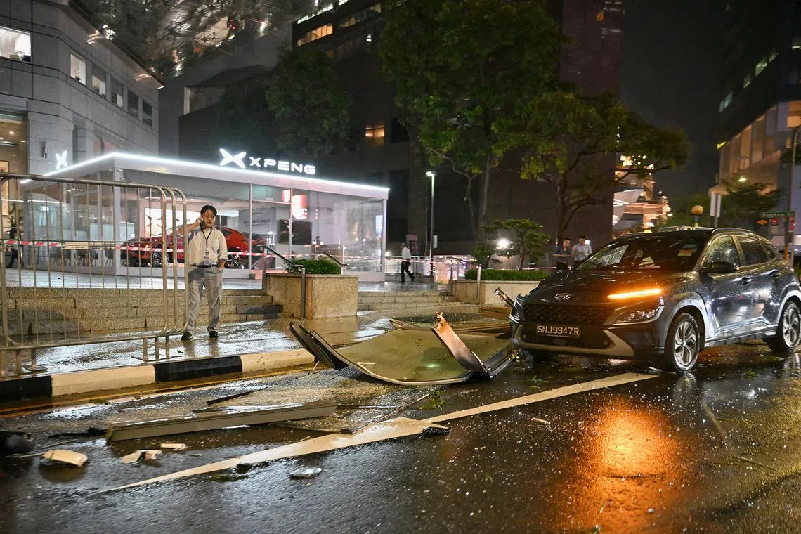 In Raffles Place, some metal debris is seen scattered on the road outside UOB Plaza and the Xpeng car showroom. on Sept 17, 2024. 