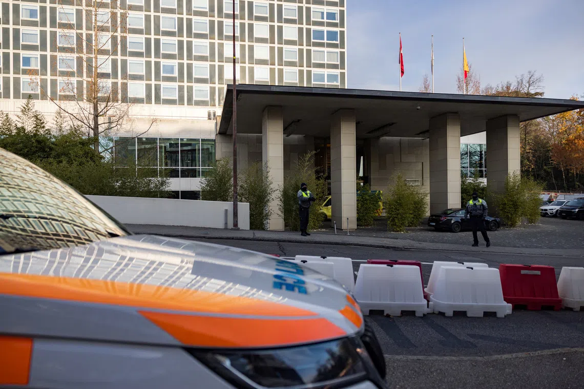 Diplomatic security officers secure the entrance of the InterContinental hotel as U.S. and Ukrainian officials prepare for closed-door talks..