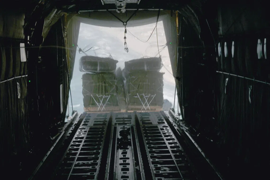 FILE PHOTO: A U.S. Air Force C-130J Super Hercules conducts an airdrop of humanitarian assistance over Gaza, March 2, 2024.  U.S. Air Force/Handout via REUTERS/FILE PHOTO