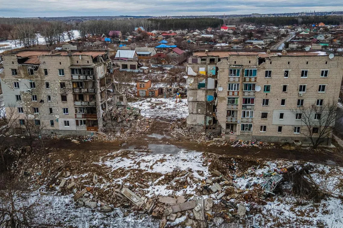 A residential building damaged by shelling in Izyum, in Ukraine's Kharkiv region, on Feb 20, 2023.