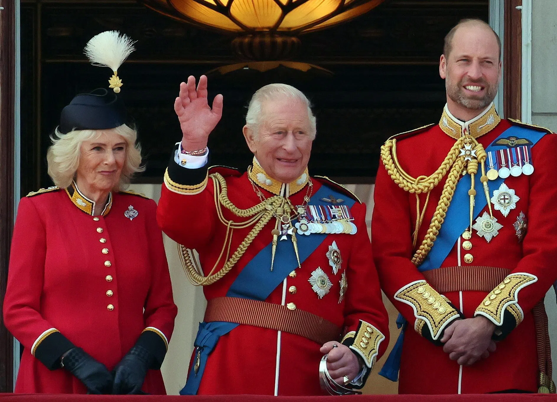 epa13034364 (L-R) Britain's Queen Camilla, King Charles III, and William, Prince of Wales, on the balcony of Buckingham Palace during the Trooping the Colour, The King's Birthday Parade in London, Britain, 13 June 2026. Trooping the Colour is a ceremonial event performed each year by regiments of the Household Division to celebrate the official birthday of the British sovereign. EPA/ANDY RAIN