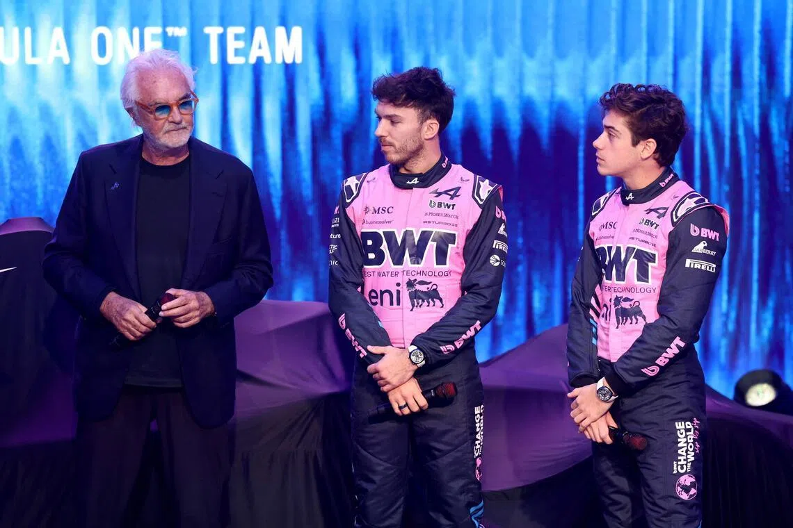 From left: Alpine's executive advisor Flavio Briatore, French driver Pierre Gasly and Argentinian driver Franco Colapinto talking on stage during the launch of the new car on Jan 23, 2026, in Barcelona.