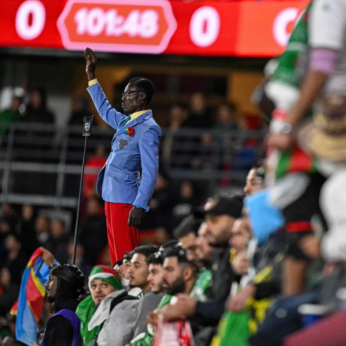 Michel Kuka Mboladinga has earned fame as the fan who stands completely immobile throughout his team’s games.