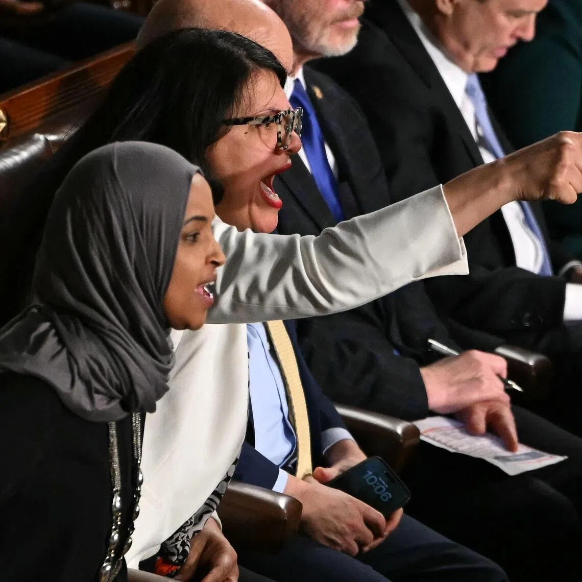(left to right) US representatives Ilhan Omar and Rashida Tlaib  criticised Mr Trump as he touted his administration’s hardline immigration crackdown and its immigration enforcement actions.