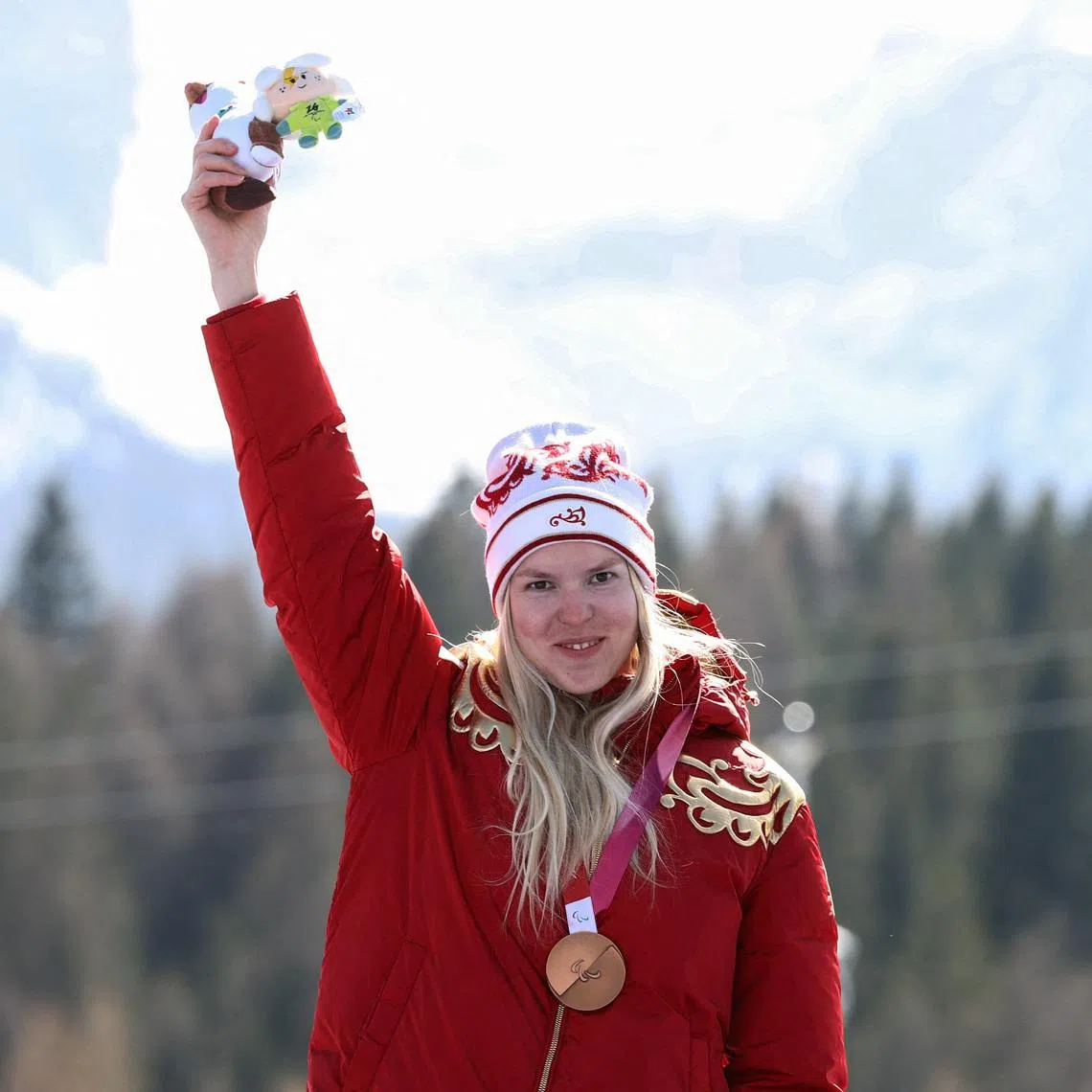 Milano Cortina 2026 Paralympics - Para Alpine Skiing - Women's Downhill Standing Victory Ceremony - Tofane Alpine Skiing Centre, Belluno, Italy - March 07, 2026. Bronze medalist Varvara Voronchikhina of Russia celebrates on the podium during the women's downhill standing victory ceremony REUTERS/Stoyan Nenov