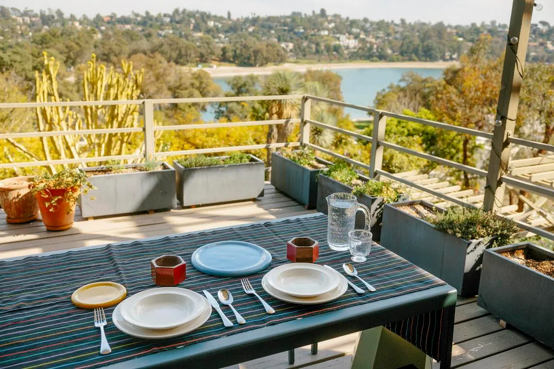 Kerrilynn Pamer’s outdoor dining setup at her home in Los Angeles, March 3, 2026. Interior design and personal style are being showcased more often on dining room tables around the country. (Stella Kalinina/The New York Times)