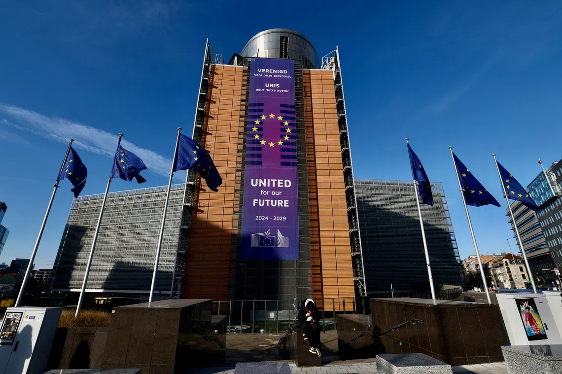 European Union flags flutter outside the European Commission headquarters in Brussels, Belgium December 15, 2025. REUTERS/Yves Herman