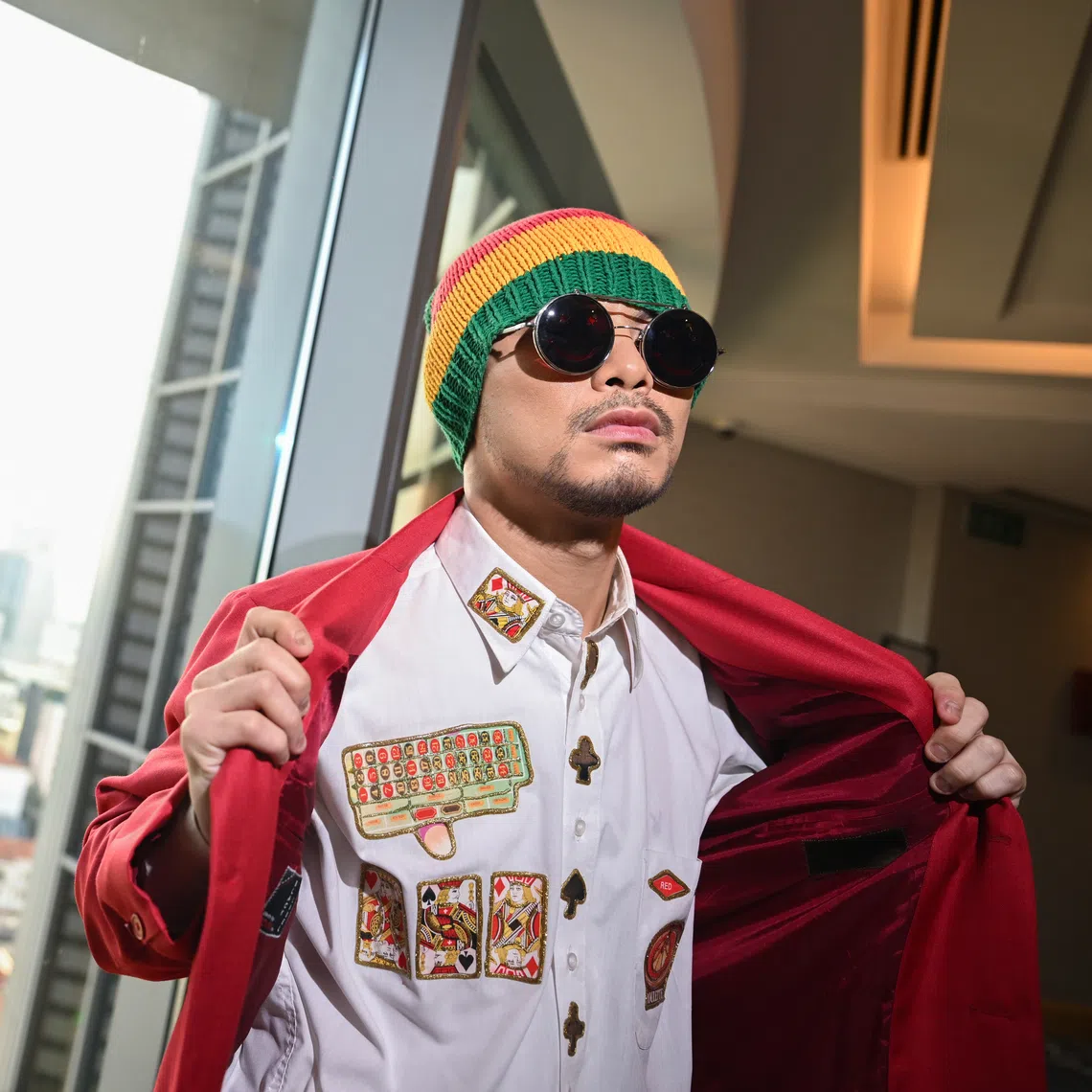 Namewee's girlfriend - who is also his stylist and makeup artist - accompanied him to Dang Wangi district police headquarters.