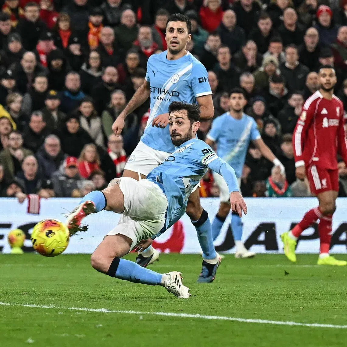 Manchester City's Portuguese midfielder Bernardo Silva scoring the equaliser during the 2-1 English Premier League win at Anfield on Feb 8, 2026.