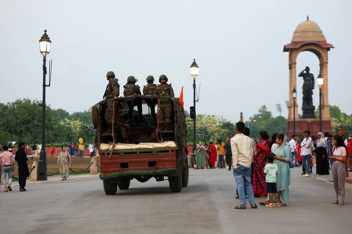 Military personnel with Indian Army stand guard at India Gate in New Delhi, India, May 8, 2025. REUTERS/Anushree Fadnavis