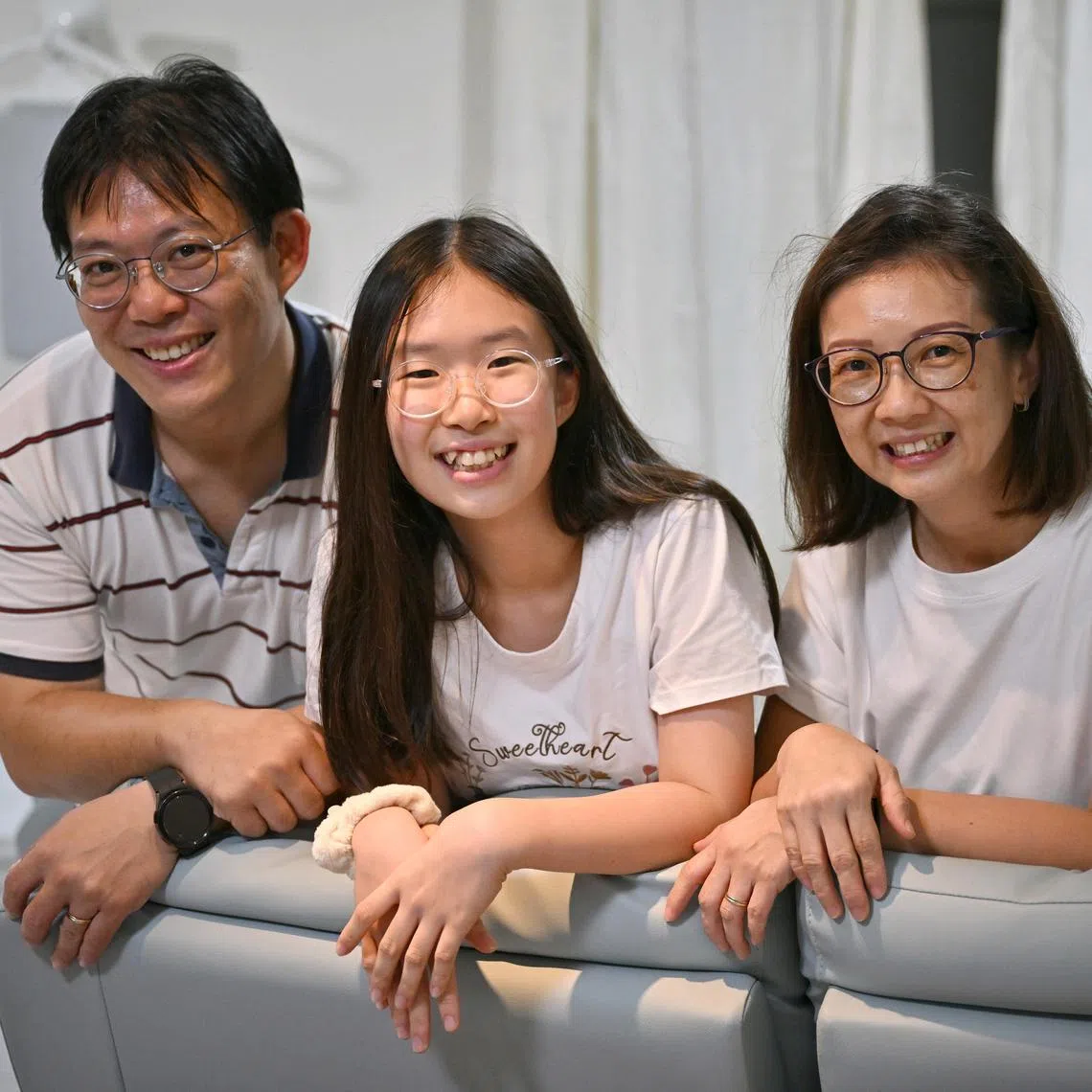 Lai Jia Chi (centre with her parents, Mr Lai Shu Hau and Ms Liew Pui Yee.