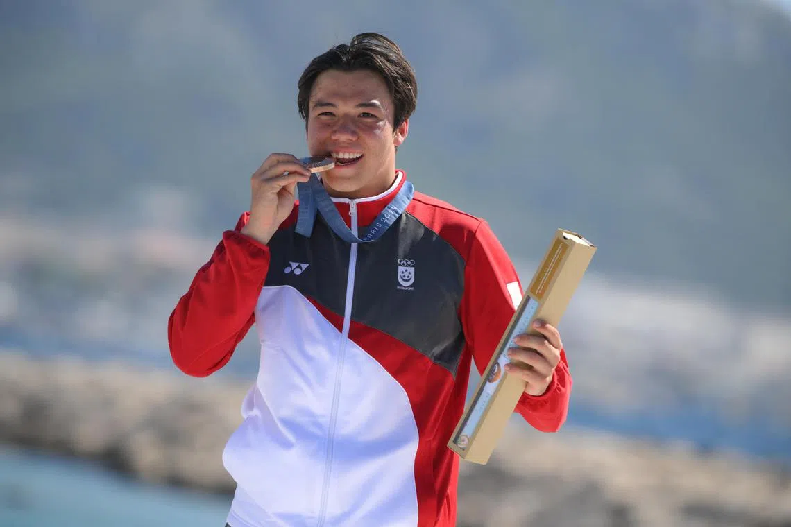 Singaporean Kitefoiler Maximilian Maeder with his bronze medal of the Paris 2024 Olympics Men’s Kite event at the Marseille Marina on August 9.