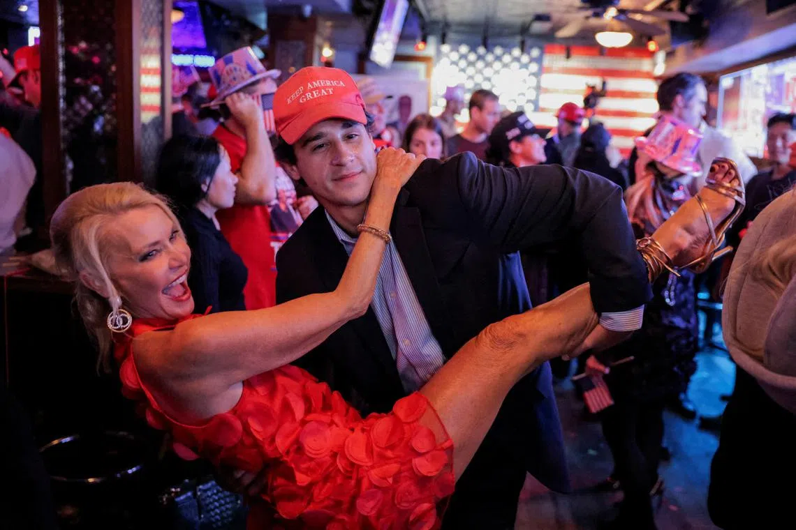 Supporters of Republican presidential nominee and former US President Donald Trump dancing as they react to election results while attending the New York Young Republican Club watch party during the 2024 US presidential election, in Manhattan, New York City, US, Nov 6, 2024. 