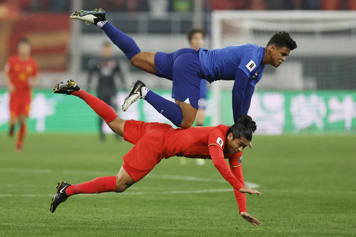Soccer Football - AFC Qualifiers - Group C - China v Singapore - Tianjin Olympic Center, Tianjin, China - March 26, 2024
Singapore's Irfan Fandi in action with China's Yuning Zhang REUTERS/Tingshu Wang
