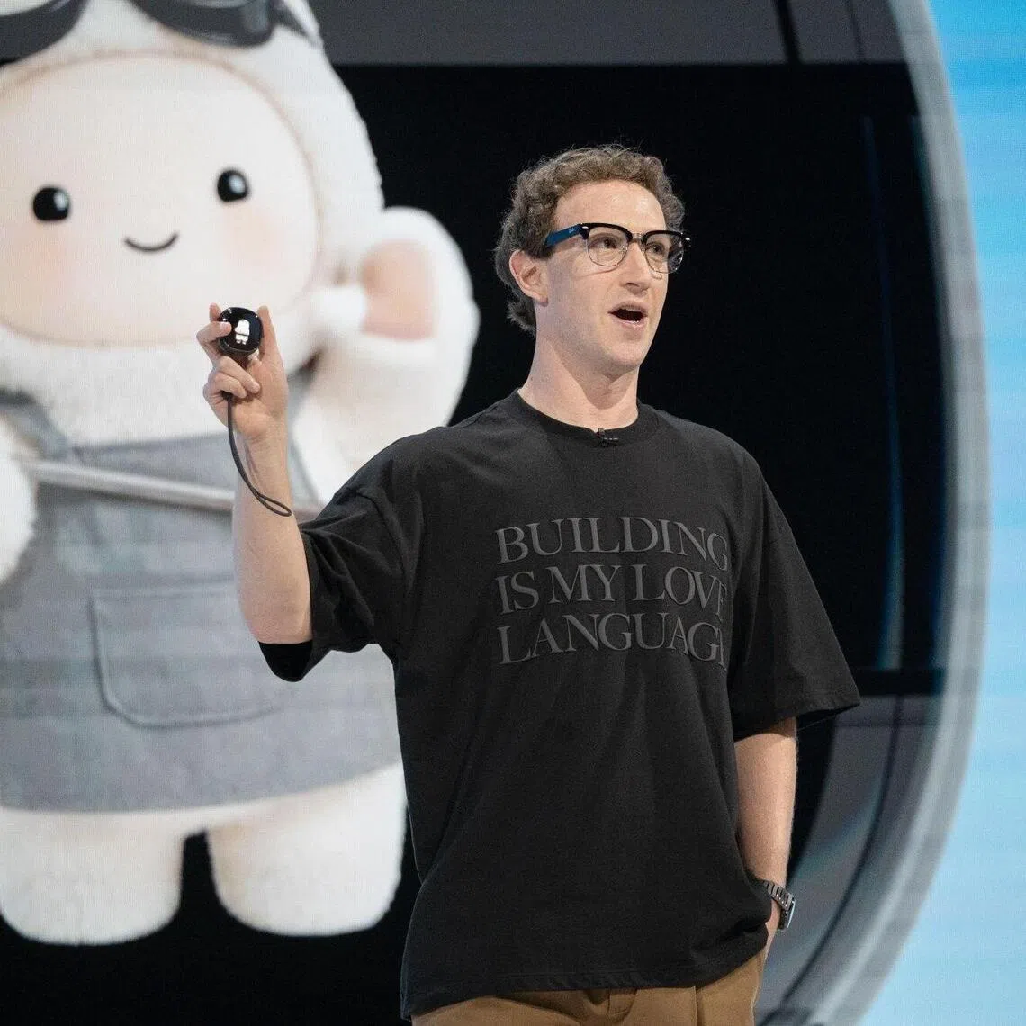 Meta CEO Mark Zuckerberg reveals the Muse Charm device during the Meta Connect event on Sept 23.