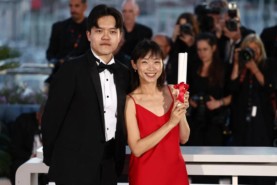 (From left) Chiang Wei Liang and Yin You Qiao Yin, winners of the Special Mention Camera d'Or Award for Mongrel, pose during a photocall after the closing ceremony of the 77th Cannes Film Festival in Cannes, France, on May 25, 2024. 