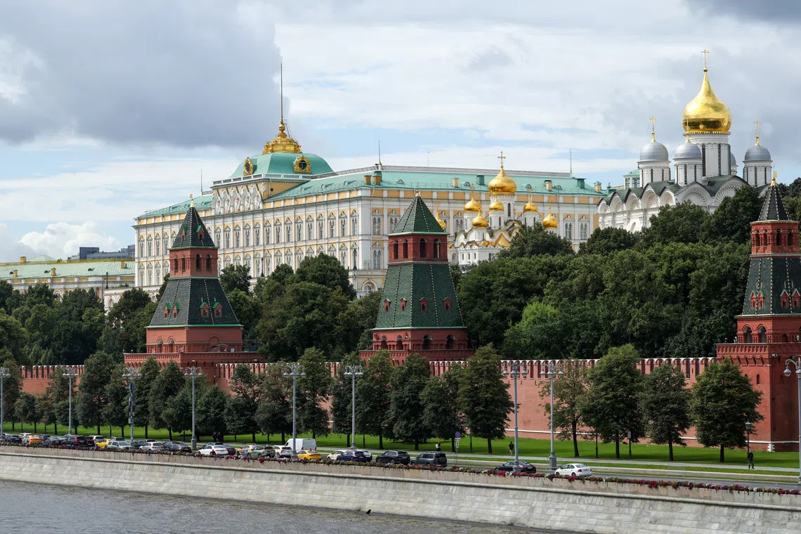 FILE PHOTO: A view shows the Kremlin's towers, the Grand Kremlin Palace and cathedrals behind the wall in central Moscow, Russia, August 7, 2025. REUTERS/Evgenia Novozhenina/ File Photo