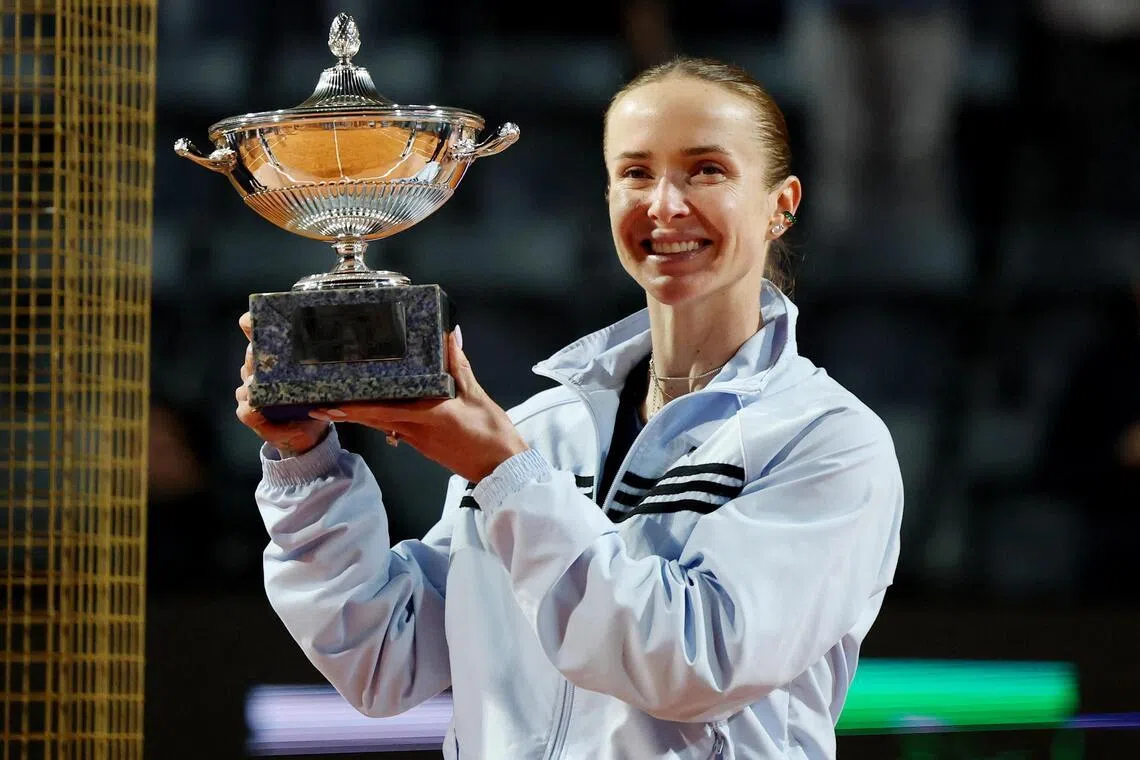 Ukraine's Elina Svitolina celebrating with the trophy after defeating Coco Gauff of the US in the May 16 final.