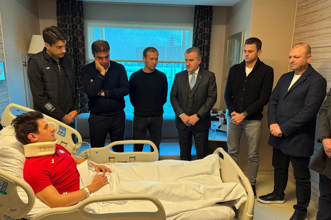 Turkish Minister of Youth and Sports Osman Askin Bak (centre right) visiting Turkish referee Halil Umut Meler who was hospitalised after being punched by the president of Ankaragucu, Faruk Koca.