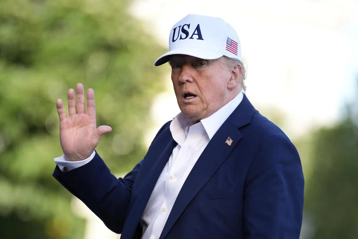 US President Donald Trump waves to reporters on the South Lawn of the White House on July 6.