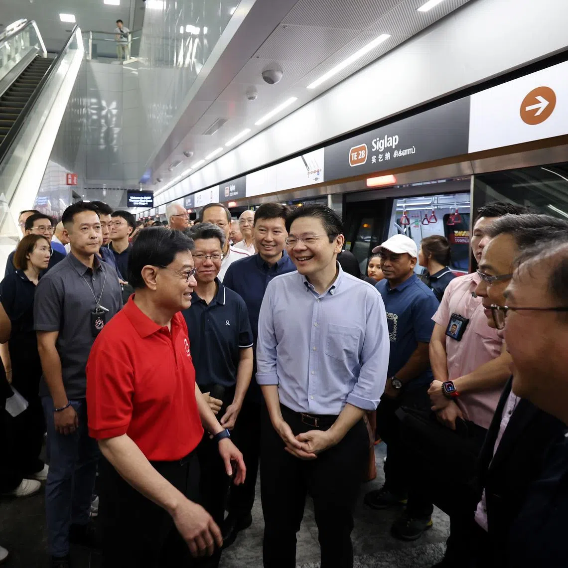 PM Lawrence Wong (centre) with DPM Heng Swee Keat (left) at Siglap station along the Thomson-East Coast Line (TEL) following the opening ceremony for the TEL stage four stations, on June 21.