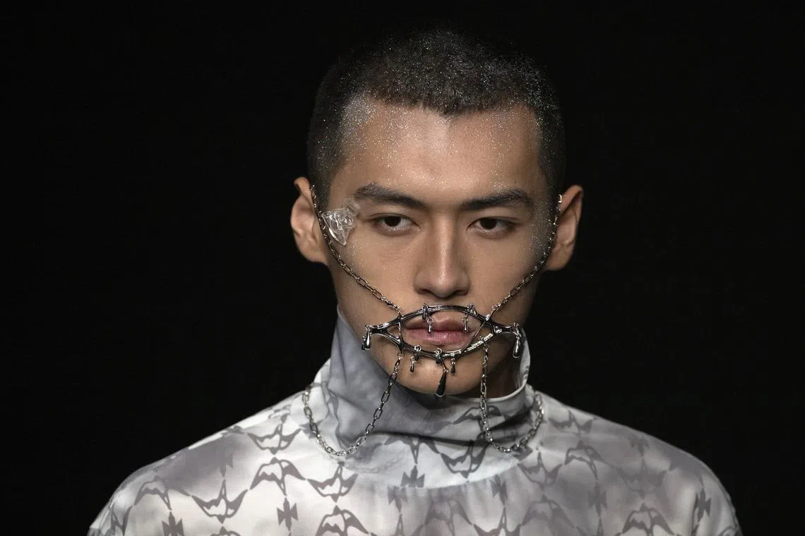 A model presenting creations of Moe Ho by Mengmeng He on Sept 8.