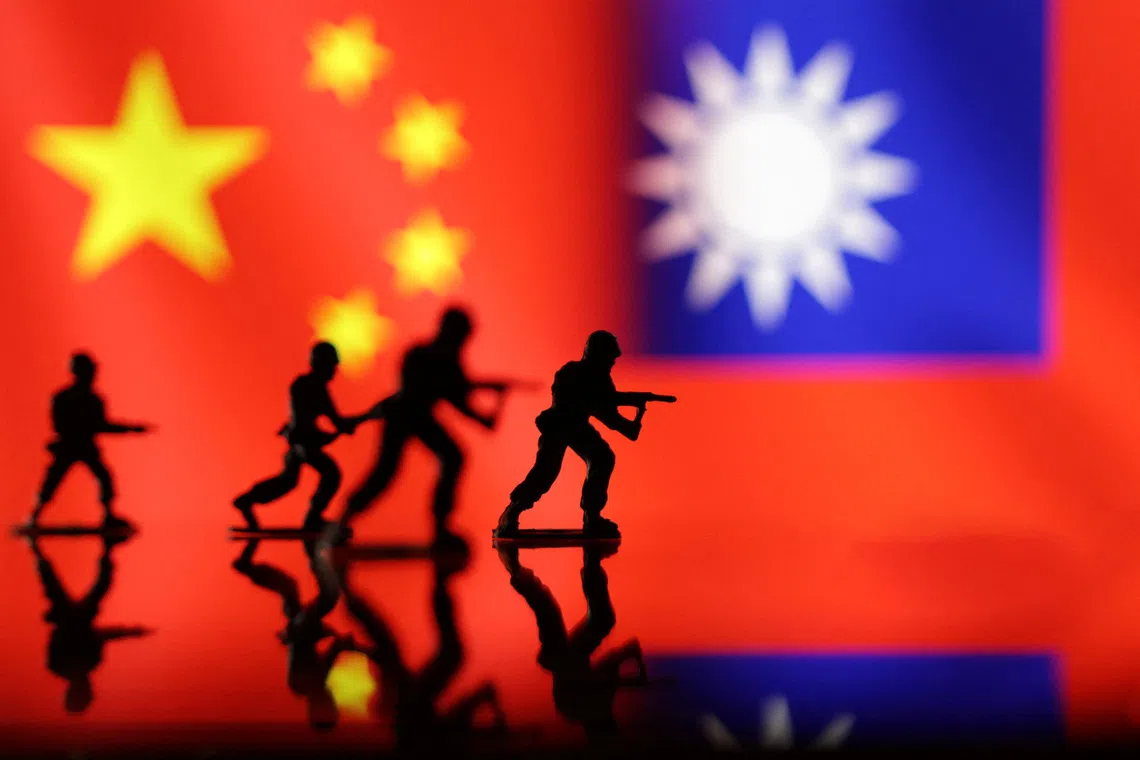 Solider miniatures are seen in front of displayed Chinese and Taiwanese flags in this illustration taken, April 11, 2023. REUTERS/Dado Ruvic/Illustration