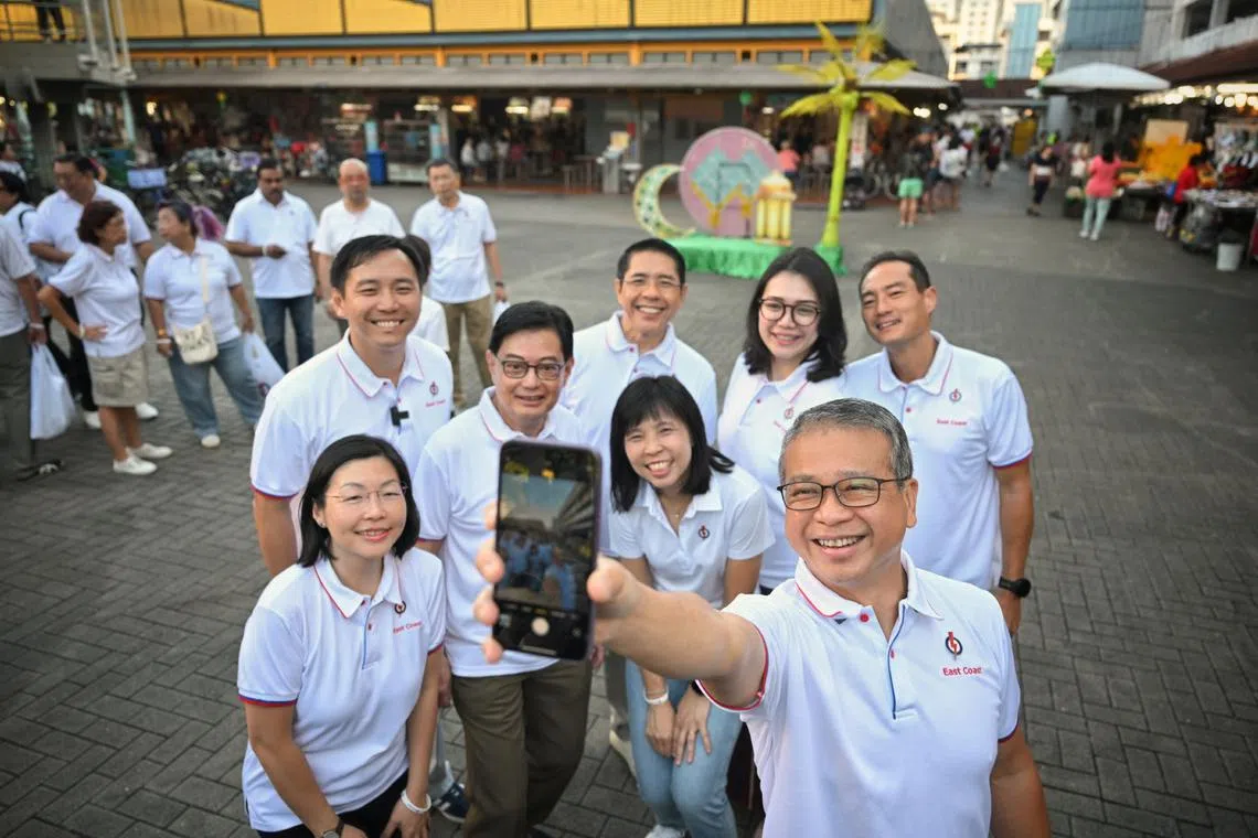 Former brigadier-general Goh Pei Ming (second row; far left) and Madam Hazlina Abdul Halim (second row; second from right), the former chief executive of Make-A-Wish Singapore, joined five East Coast MPs and Joo Chiat MP Edwin Tong on a walkabout at Bedok 85 Market on April 12.