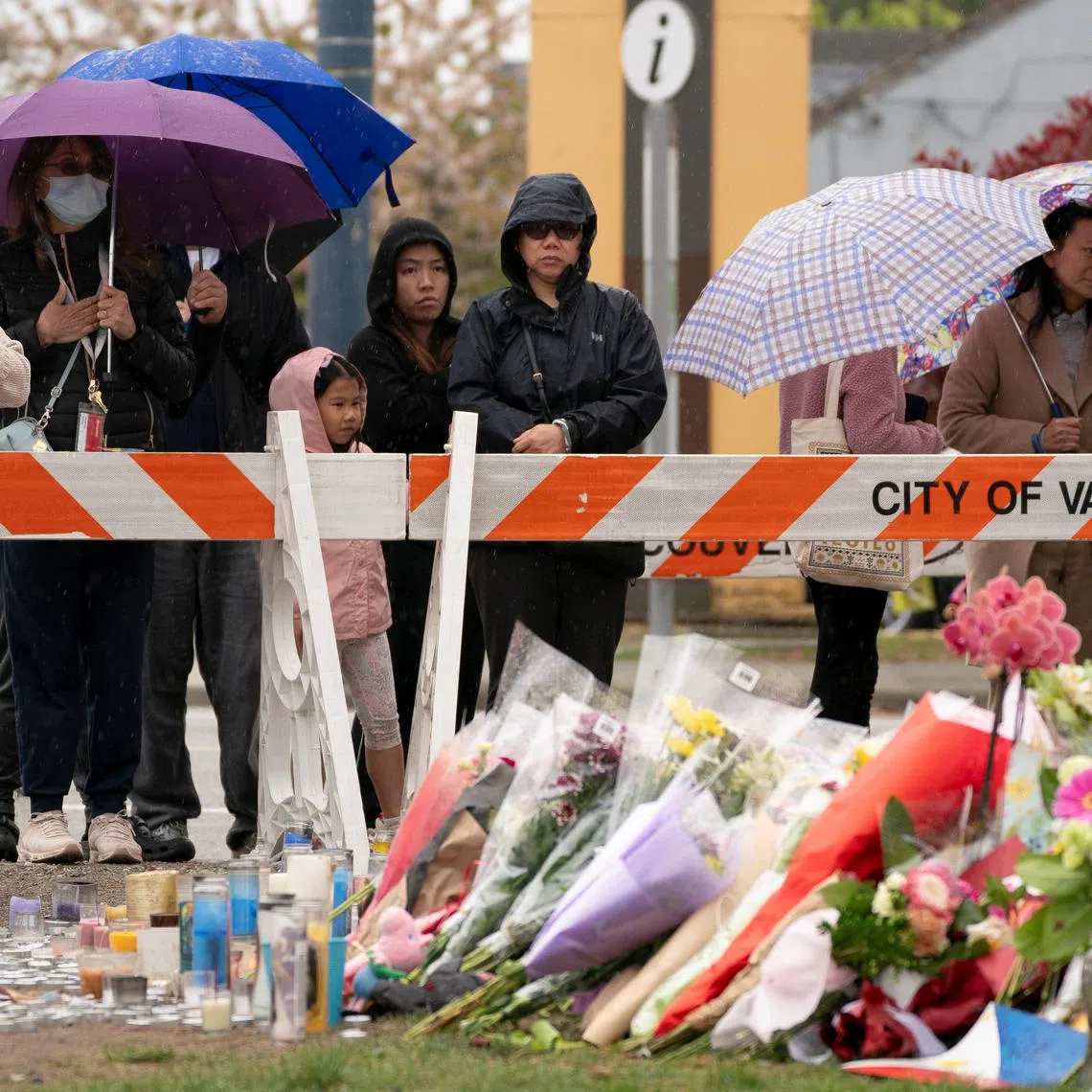 People visit a memorial site two days after a vehicle was driven into a crowd at a Filipino community Lapu Lapu Day block party, in Vancouver, British Columbia, Canada April 28, 2025. REUTERS/David Ryder
