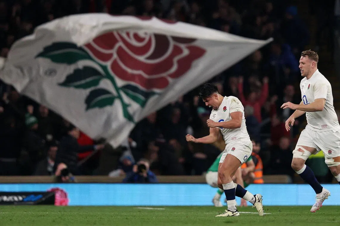 England's Marcus Smith (left) celebrating his drop goal during the Six Nations match between against Ireland at Twickenham Stadium in on March 9. 