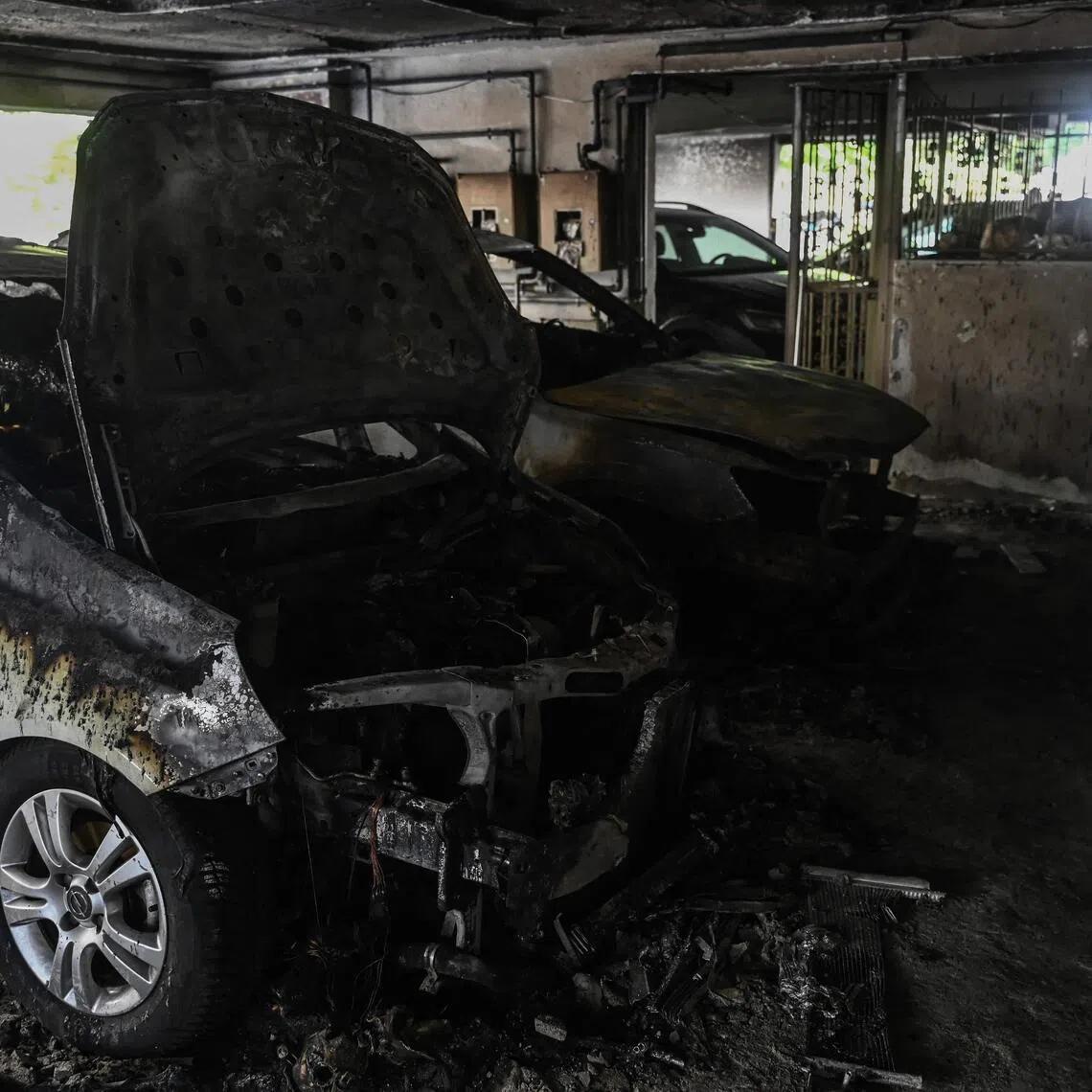 Damaged cars at a building in Thessaloniki, Greece, after a gas canister bomb exploded at the entrance on July 1.