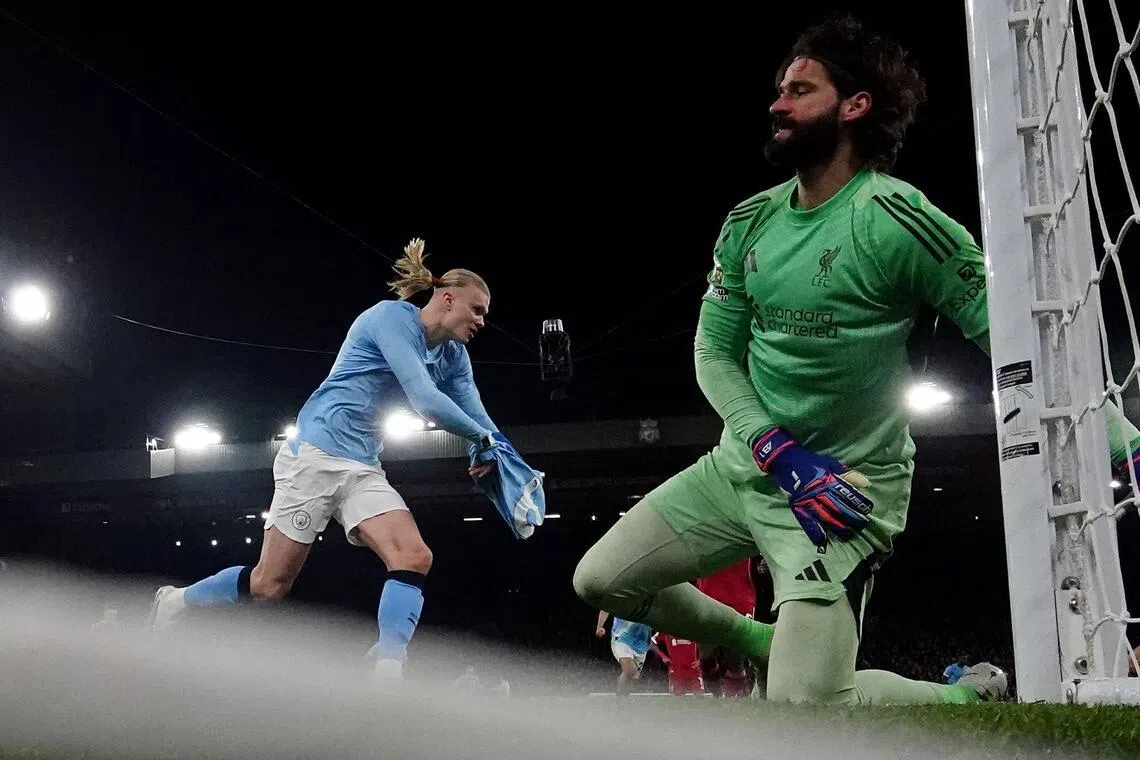 Manchester City's Norwegian striker Erling Haaland celebrating after scoring a penalty past Brazilian goalkeeper Alisson Becker at Anfield in the 2-1 English Premier League win over Liverpool on Feb 8, 2026.