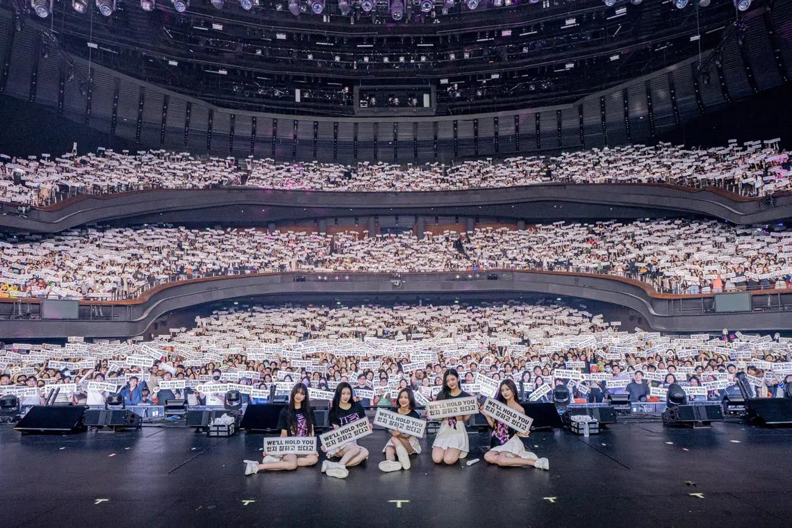 K-pop girl group Itzy, from left: Yuna, Chaeryeong, Ryujin, Lia and Yeji, with their fans at their sold-out show at The Star Theatre on Jan 28.

