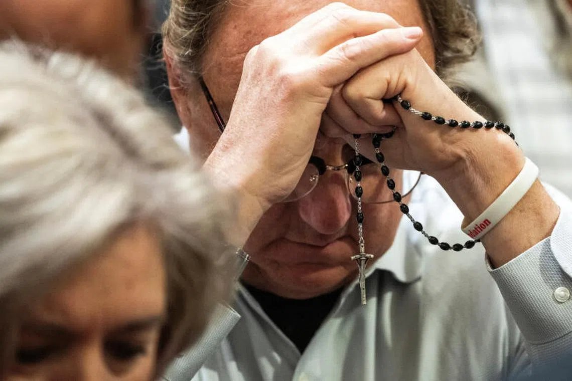 Pilgrims pray for Pope Francis' health during a Mass celebrated by the Archbishop of New York Cardinal Timothy Dolan at Saint Patrick's Cathedral in New York City, U.S., February 23, 2025. REUTERS/Eduardo Munoz TPX IMAGES OF THE DAY