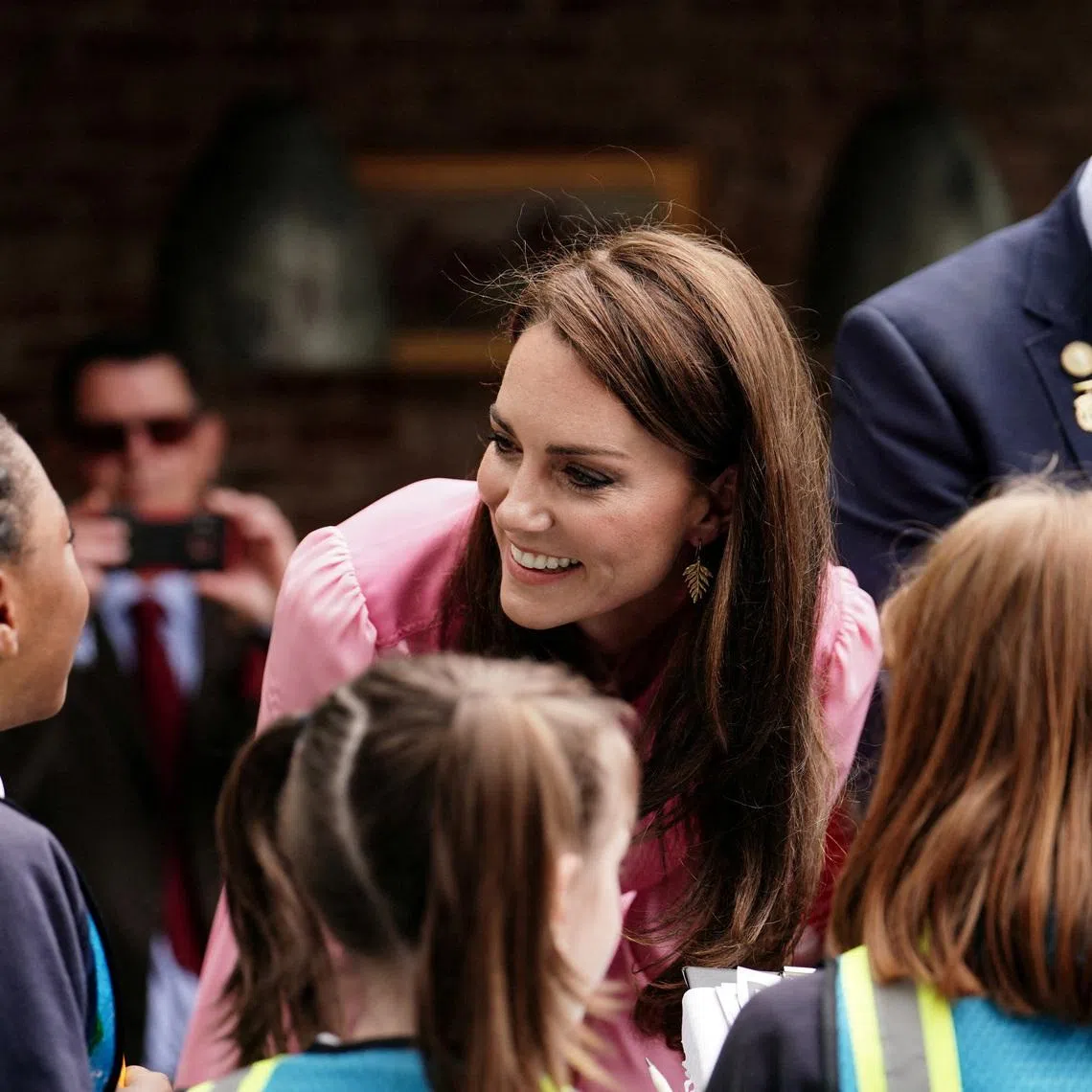 FILE PHOTO: The Princess of Wales speaks to pupils, after taking part in the first Children's Picnic at the RHS Chelsea Flower Show, at the Royal Hospital Chelsea, London, Britain, May 22, 2023. Jordan Pettitt/Pool via REUTERS/File Photo