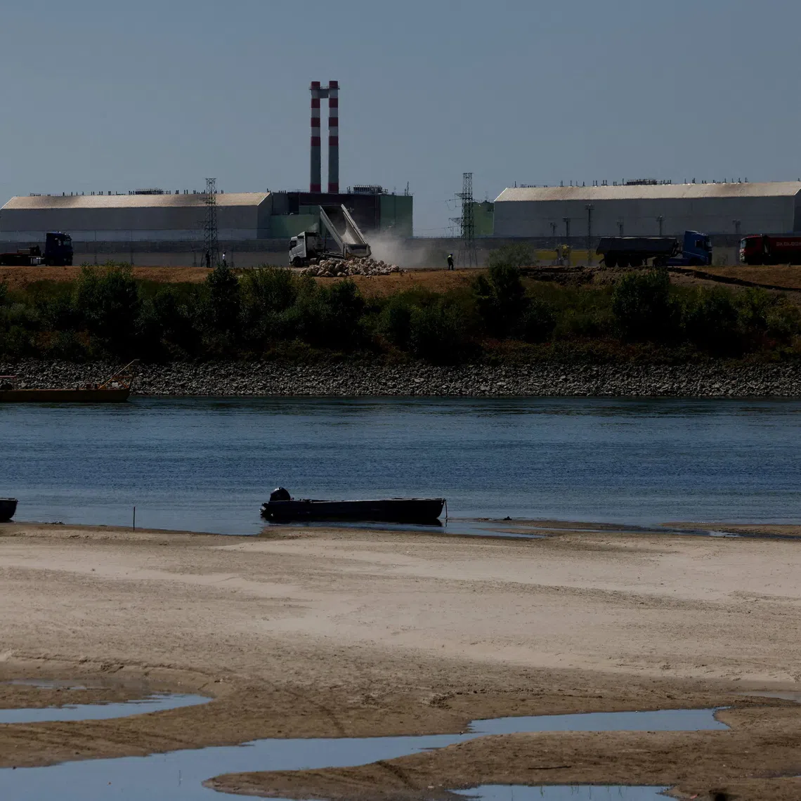 FILE PHOTO: A view of Paks Nuclear Power Plant, as the construction begins on a riverbed sill to raise the Danube's water level in Dunaszentbenedek, Hungary, August 13, 2026. REUTERS/Bernadett Szabo/File Photo