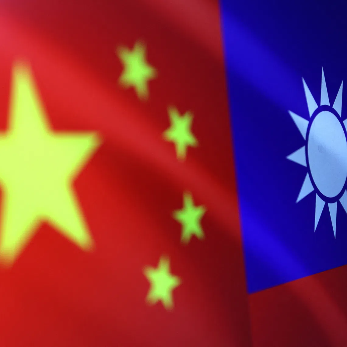 Chinese and Taiwanese flags are seen in this illustration. REUTERS/Dado Ruvic/Illustration
