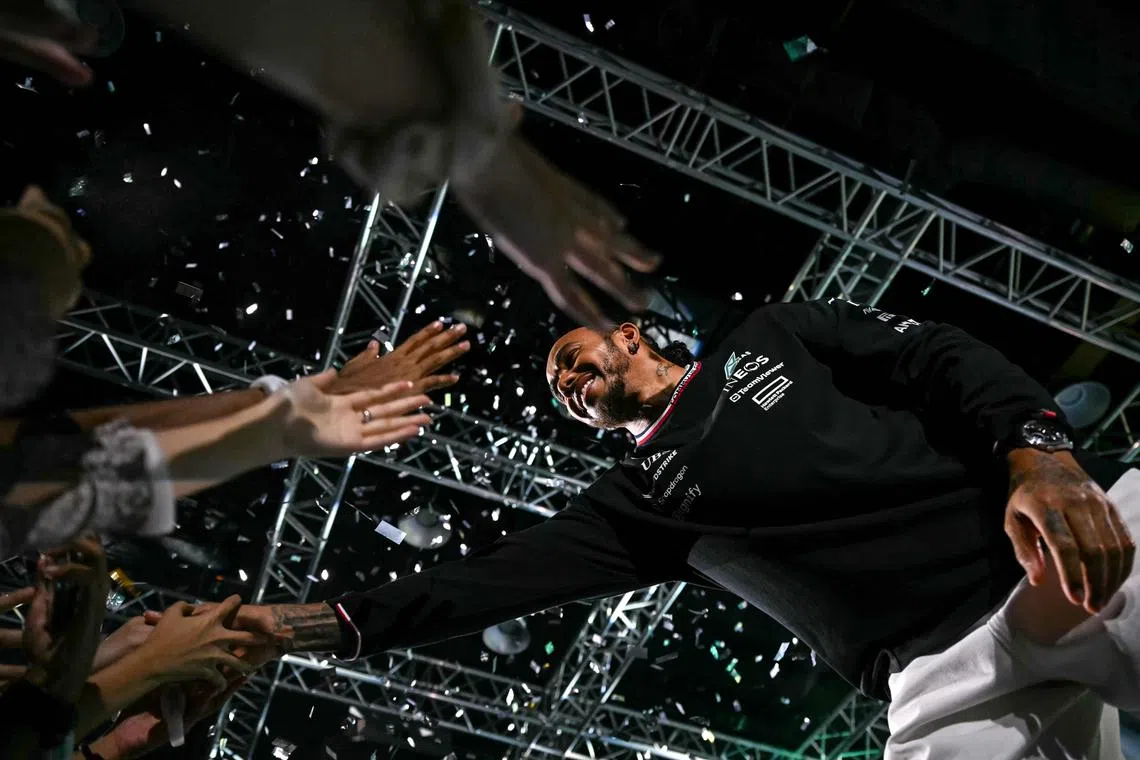 British Formula One driver Lewis Hamilton greeting fans during a farewell event for the Mercedes F1 Team at the Kuala Lumpur Convention Centre in Kuala Lumpur, on Dec 10, 2024.