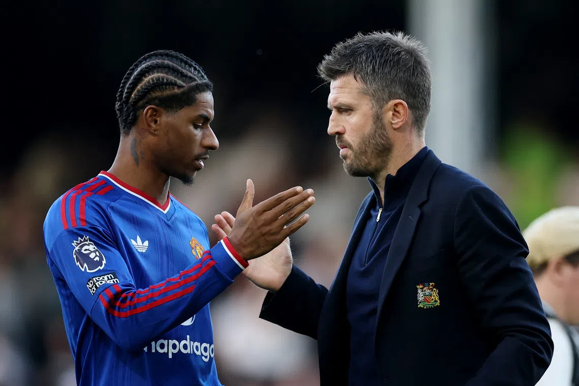 Soccer Football - Premier League - Fulham v Manchester United - Craven Cottage, London, Britain - September 20, 2026 Manchester United's Marcus Rashford and manager Michael Carrick after the match REUTERS/Toby Melville