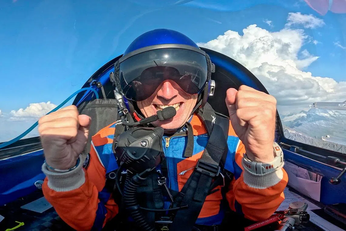 Swiss pilot Raphael Domjan reacting after receiving the news that he beat the altitude record for a solar-powered electric plane. 