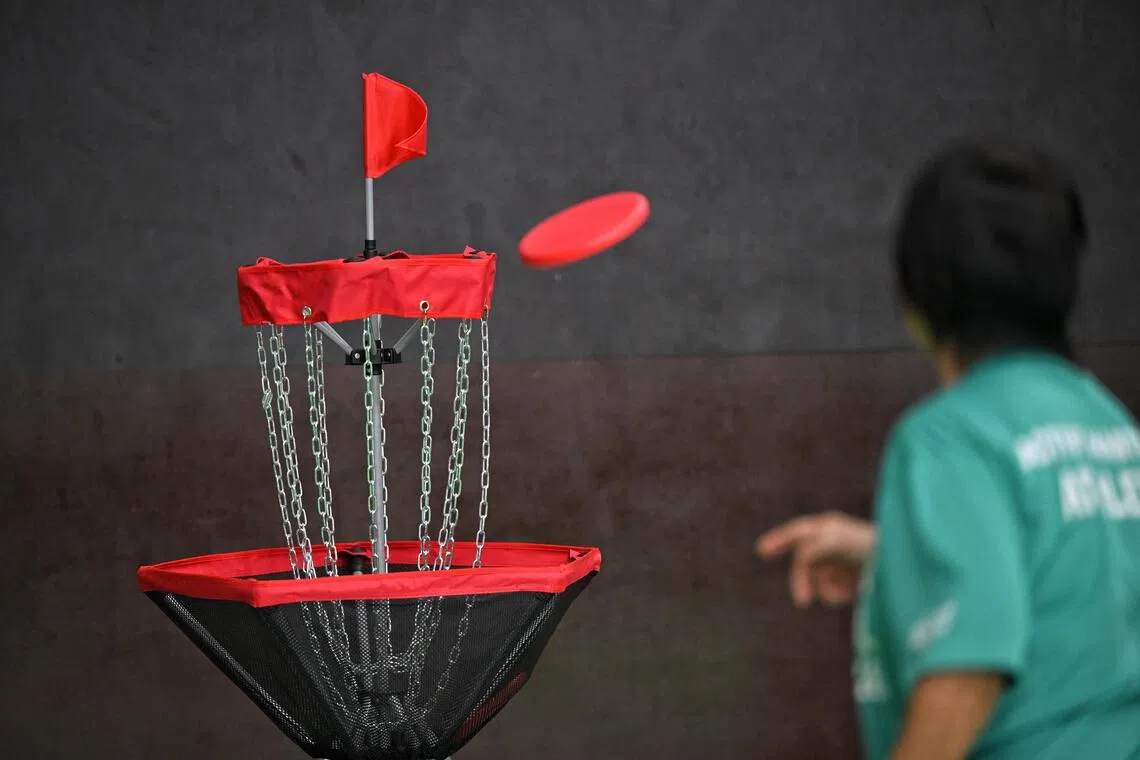 Disc golf requires players to throw a disc at a target,  which ends up in basket-like contraption, and using uses similar to golf