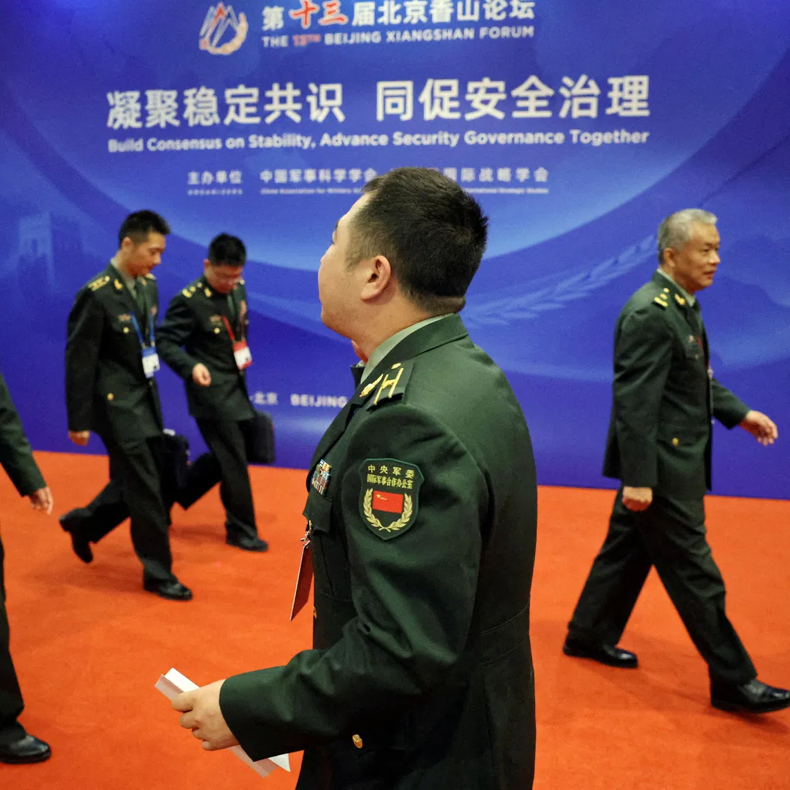 Military delegates walk outside the venue of the opening ceremony for the Beijing Xiangshan Forum in Beijing, China September 16, 2026. REUTERS/Florence Lo