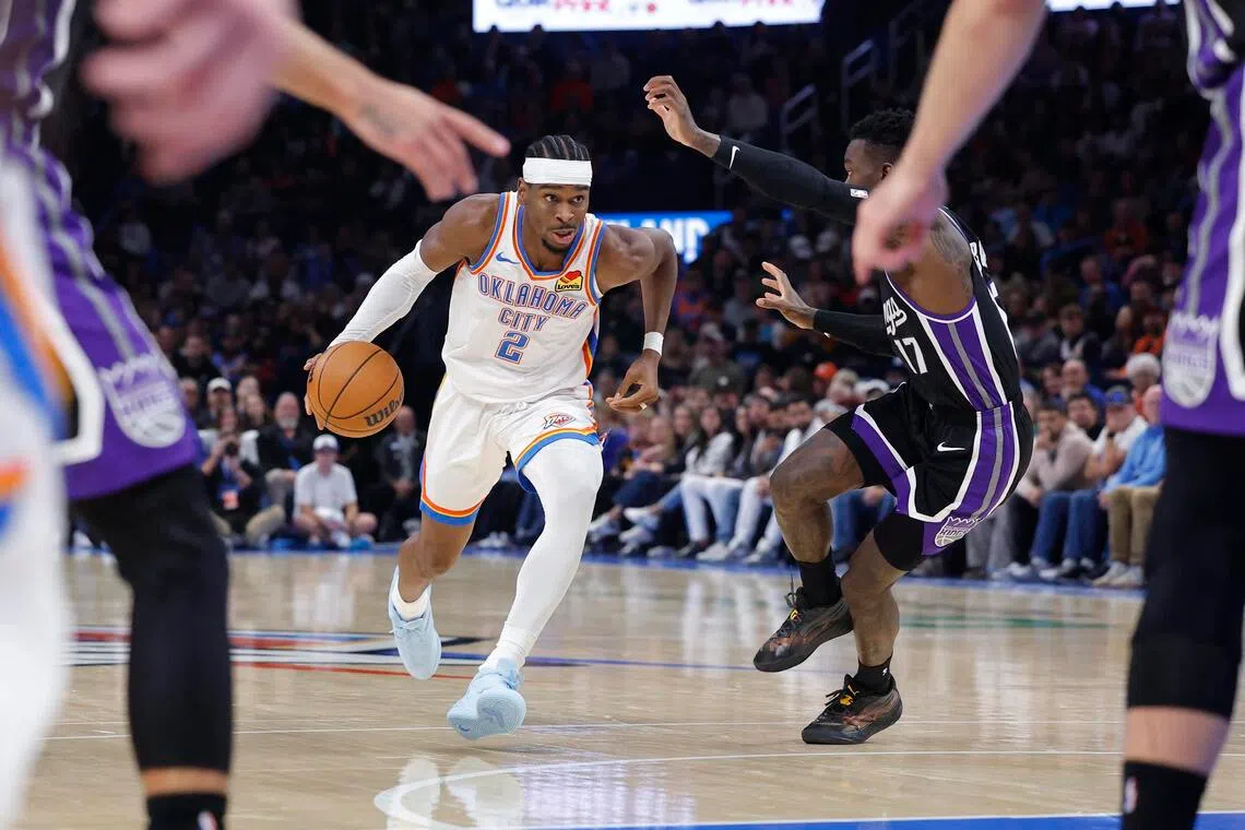 Oklahoma City Thunder guard Shai Gilgeous-Alexander driving down the court against Sacramento Kings guard Dennis Schroder during the second half of the 107-101 NBA win at Paycom Centre on Oct 28.