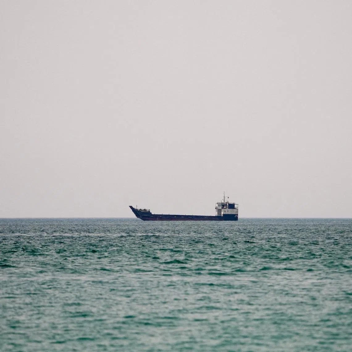 A vessel at the Strait of Hormuz, as seen from Musandam, Oman, June 29, 2026. REUTERS/Stringer
